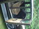 1929 Ford Model A - The interior of a classic car shows its aged seats, door panels, and steering wheel.