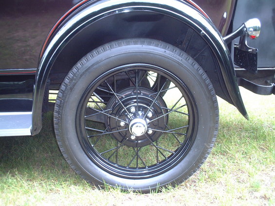 Black wire wheel and fender of a 1929 Ford Model A