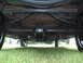 1929 Ford Model A - The undercarriage of a 1929 Ford Model A reveals its mechanical components and wooden floor construction.