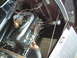1929 Ford Model A - The engine compartment of an older vehicle is shown, focusing on the mechanical components.