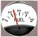1978 Ford Mustang II - A close-up of a fuel gauge indicates the price of fuel rather than the quantity.
