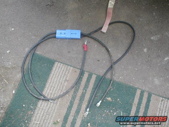 Blue Anderson connector with two black cables and ring terminals