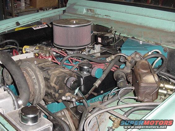 Engine bay with V8 engine, air filter, and brake master cylinder