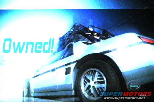 1986 Pontiac Fiero, white, 3/4 front view, with 'Owned!' text overlay