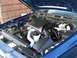 1998 Ford Crown Victoria - Engine bay of a blue Ford Crown Victoria, viewed from above with the hood raised.
