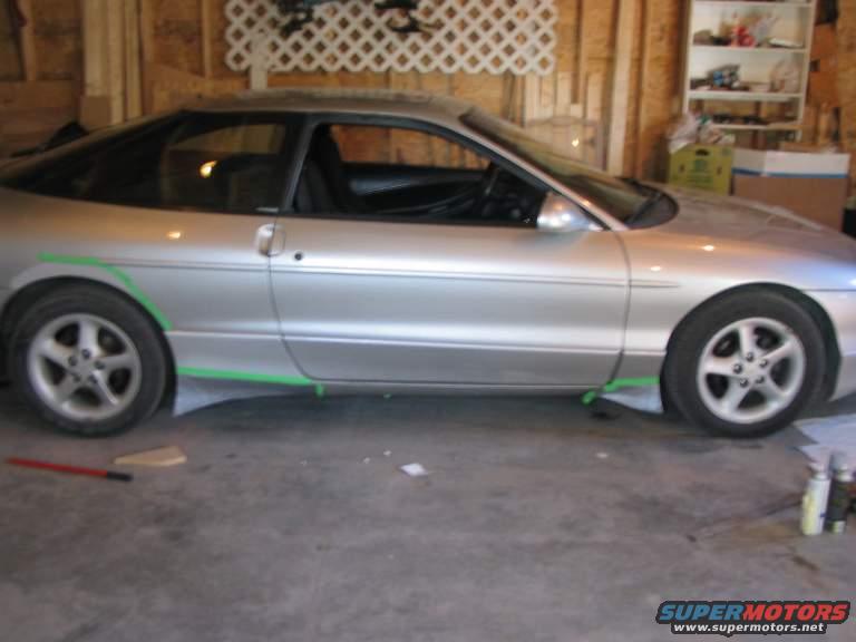 Silver 1993 Ford Probe side view with green markings on side skirts