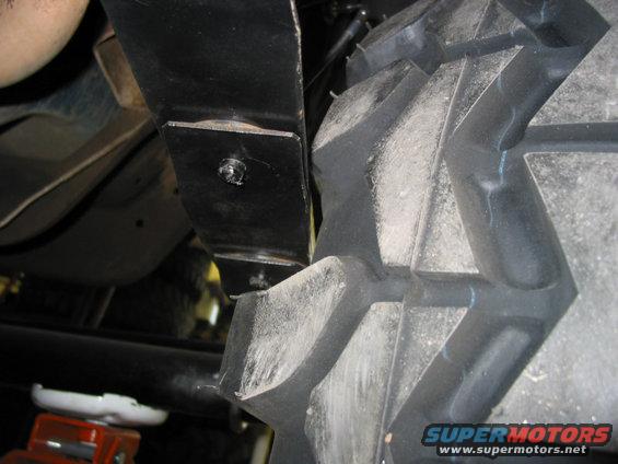 reartire2spring.jpg At full lock the rear of the tire hits the spring. Have to adjust the steering stops.