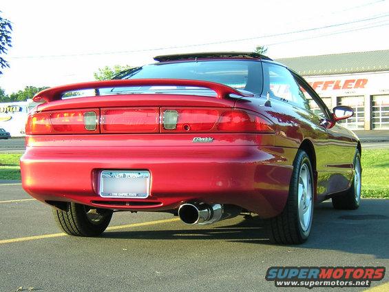 Red 1995 Ford Probe GT rear view with spoiler and dual exhaust