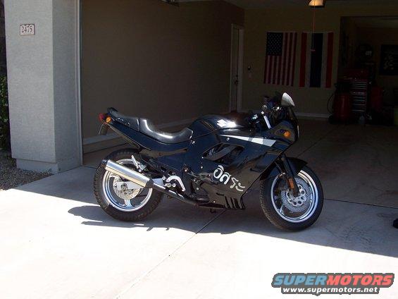 Black sport motorcycle parked in a garage