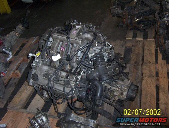 Engine assembly on wooden pallets