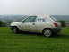 2001 Ford Fiesta - Side view of a white 2001 Ford Fiesta panel van with BT branding, parked outdoors.
