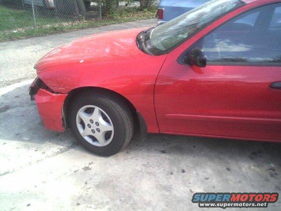 Red 2005 Chevrolet Cavalier with front-end damage, viewed from the front-left