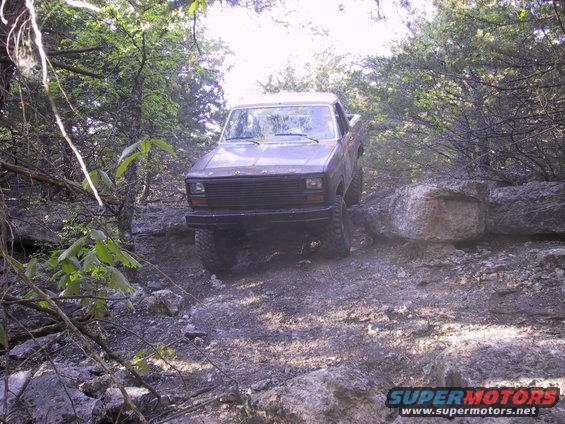 Ford Bronco navigating a rocky trail, front view
