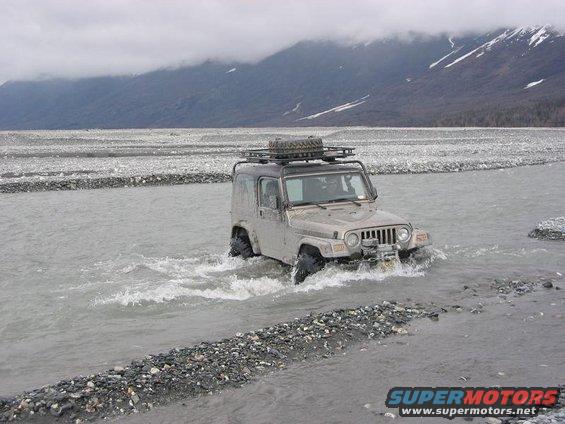 img_2361.jpg We picked this guy up before the hoods, I think his name was John. Thats a 2004 TJ it's only 3 months off the show room floor. He's crossing Metal creek as well.