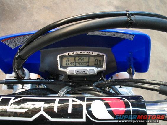 Motorcycle digital dashboard with 'ENDURANCE' text, showing '0.47', '254', and '0.0' readings