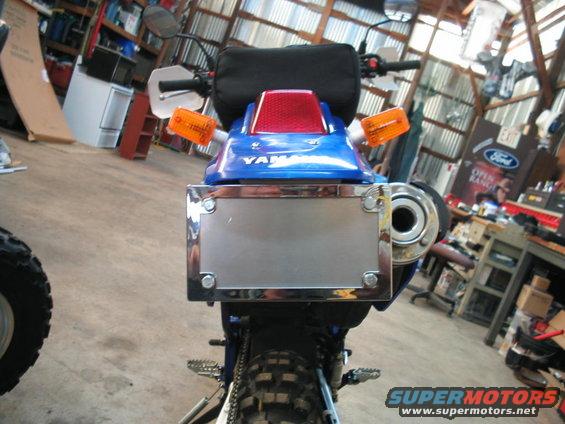 Blue Yamaha motorcycle rear with chrome license plate holder