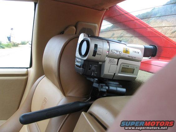 Sony Handycam on tripod in car interior, looking out rear window