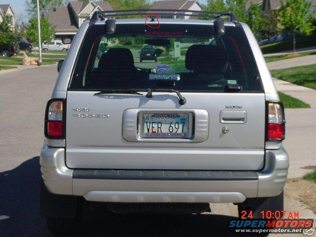 Silver 2000 Isuzu Rodeo rear view with license plate VER 697