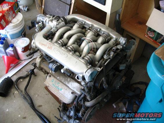 Ford engine with '92 written on intake manifold