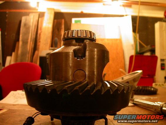 dscn1941.jpg New 4.56 ring gear installed on the E-locker.  Notice that the cross pin can no longer slide out due to interference with the tips of the gear teeth.  To the grinder!