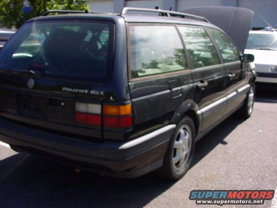 Black wagon rear view with "Passat GLX" badge visible