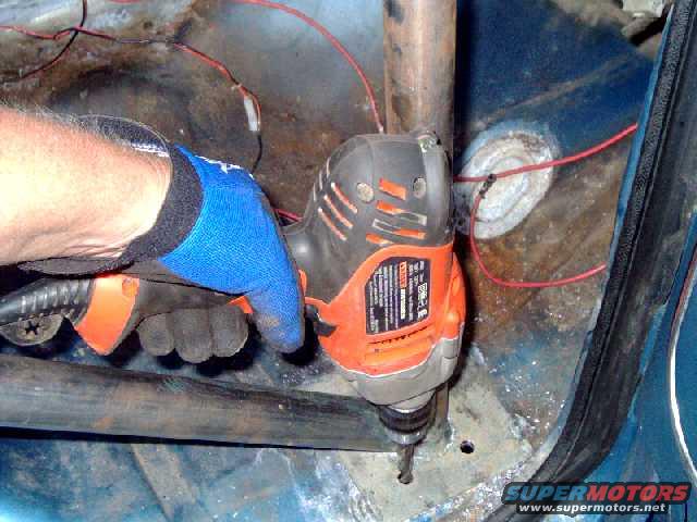 drilling 1/2" holes for bolts to attach lower plate.