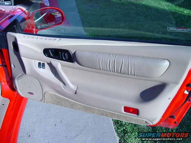 car door panel with armrest and window controls