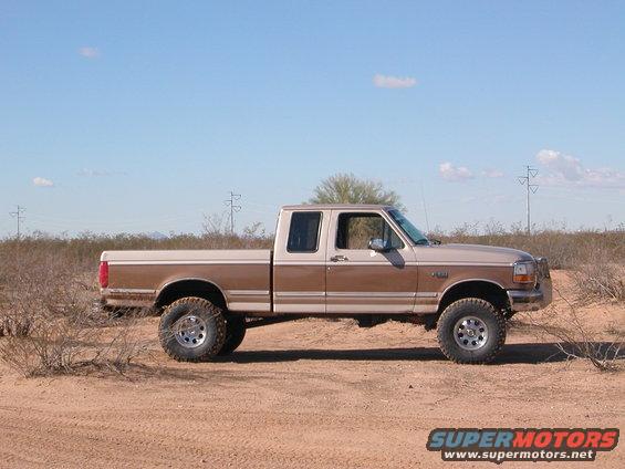 Side view of a 1992 Ford F-150 crew cab pickup truck in a desert landscape