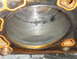 1986 Ford Mustang - Close-up view of an engine cylinder showing significant carbon deposits and a damaged gasket seal.