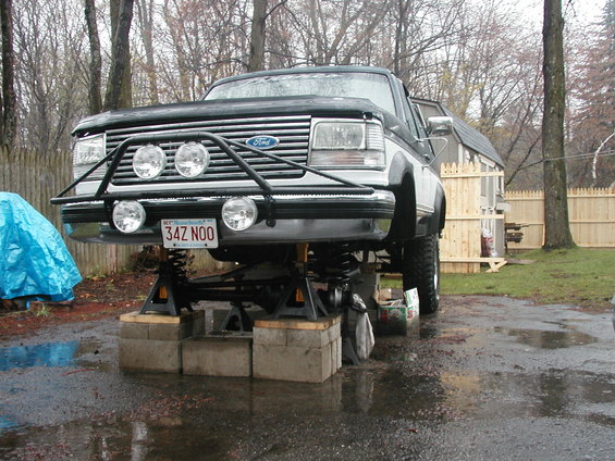 1994 Ford Bronco front view on jack stands with aftermarket bumper and lights