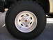1999 Ford F-150 - A close-up view of a custom Weld wheel and tire on a vehicle.