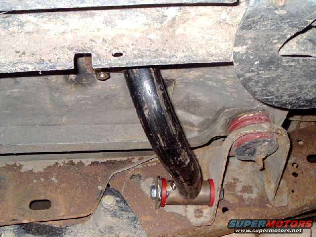 cagekit68.jpg A-pillar cage-frame mount attached to frame. The bracket for the extended radius arm interefered with a straight mount, so I used the body mount bracket for support.