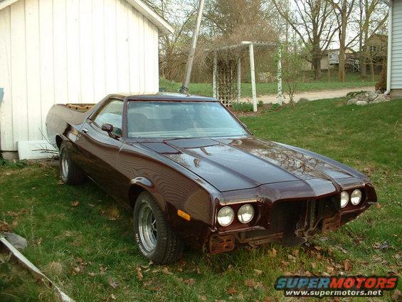 1972 Ford Ranchero parked on grass, front end partially disassembled