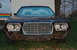 1972 Ford Ranchero - Frontal view of a dark brown 1972 Ford Ranchero with a chrome grille and dual headlights.