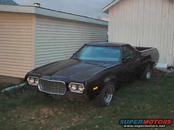 Dark brown 1972 Ford Ranchero 3q-front view parked on grass
