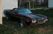 1972 Ford Ranchero - Dark colored 1972 Ford Ranchero with a chrome grille and quad headlights.
