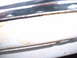 1978 Ford Mustang II - A close-up view of a vehicle's chrome trim and body panel, showing signs of wear and a website watermark.