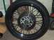 1976 Harley-Davidson Super Glide - Close-up of a motorcycle wheel assembly, including the tire and disc brake.