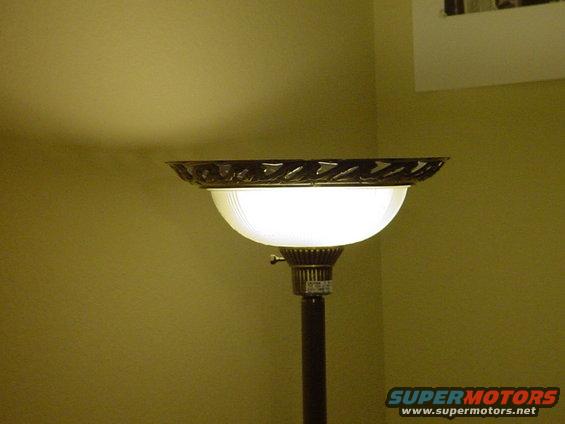 A torch lamp with a compact fluorescent screw-in type of bulb 