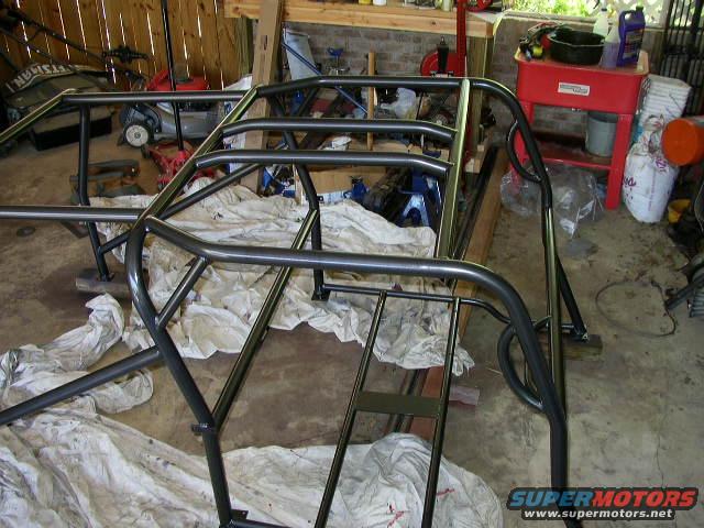 Roll cage frame in a garage setting