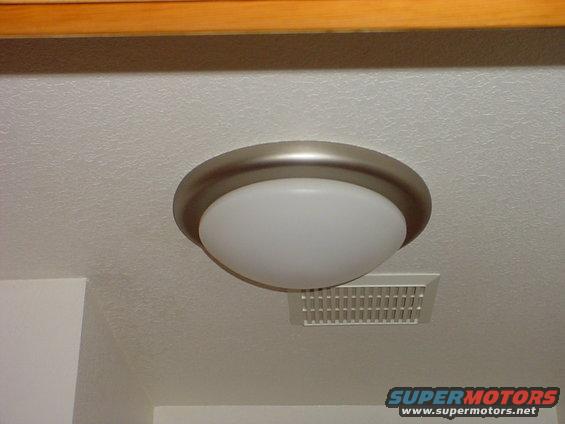 dsc00167.jpg This is a compact fluorescent light fixture, it has about 130 watts of light output, and the bulb is changable, but chances are you won't ever have to change it unless you leave it on everyday of the year.  