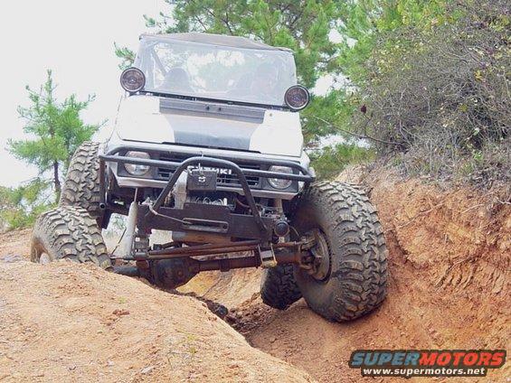 Modified Suzuki Samurai with large tires on a dirt trail