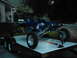 1978 Ford Bronco - Custom blue dune buggy secured to a trailer, ready for transport.