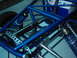 1978 Ford Bronco - Close-up view of a custom-built race car's blue tubular chassis and suspension system.