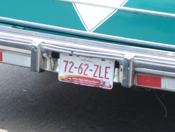 License plate 72-62-ZLE on a teal vehicle with chrome bumper and red reflectors