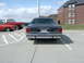1990 Ford Crown Victoria - Rear view of a 1990 Ford Crown Victoria, parked in a lot with other vehicles.