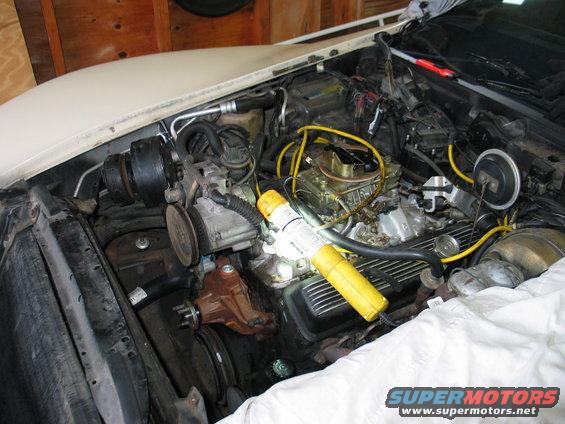 1981 Chevrolet Corvette engine bay with carburetor and yellow work light