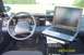 1998 Ford Crown Victoria - Interior view of a 1998 Ford Crown Victoria, equipped with a laptop and police radio equipment.