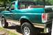 1996 Ford Bronco - This Ford Bronco has its removable top off, showing the interior and the tan trim along the lower body.