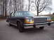 1984 Ford Crown Victoria LTD - This sedan features a prominent chrome grille and distinctive quad headlights, suggesting a specific model year.